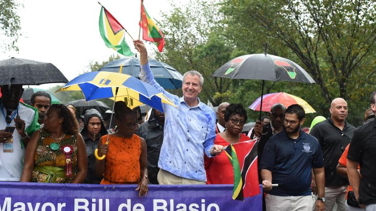 Mayor Bill de Blasio and his wife Chirlane McCray march in the West Indian American Day Parade in Crown Heights on Monday.
