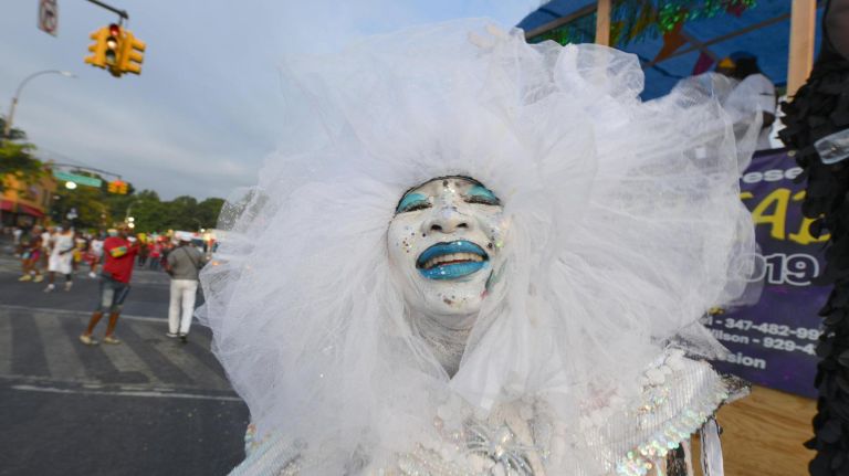 A woman in costume takes part in the annual J'Ouvert festival on Empire Boulevard in Crown Heights on Monday.