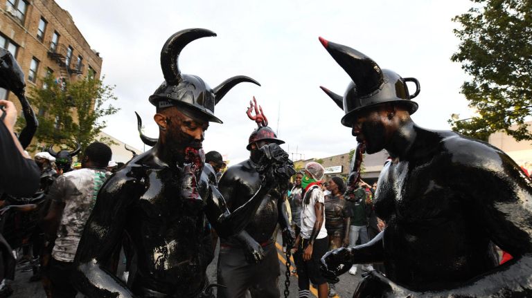 J'Ouvert festival participants celebrate&nbsp;Caribbean culture&nbsp;on Empire Boulevard in Crown Heights on Monday.