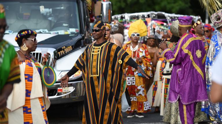 J'Ouvert festival participants gather on Empire Boulevard in Crown Heights for the annual celebration Monday.
