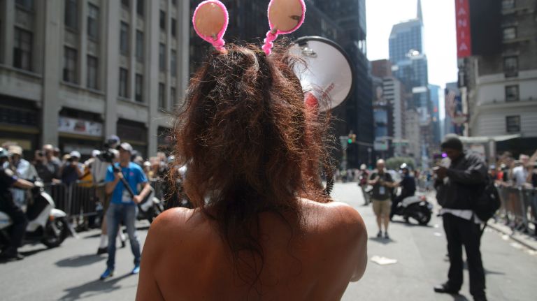 A woman speaks into a megaphone at the event.