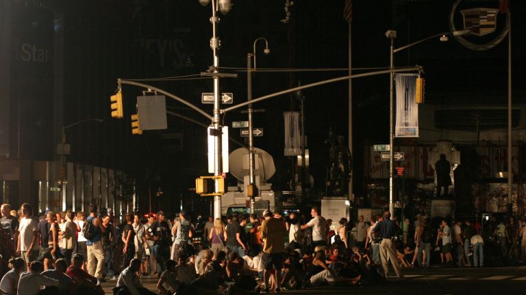 Northeast blackout 2003: Photos of NYC 10 A crowd gathers in Times Square on Aug. 15, 2003, during the Northeast blackout that began the day before.