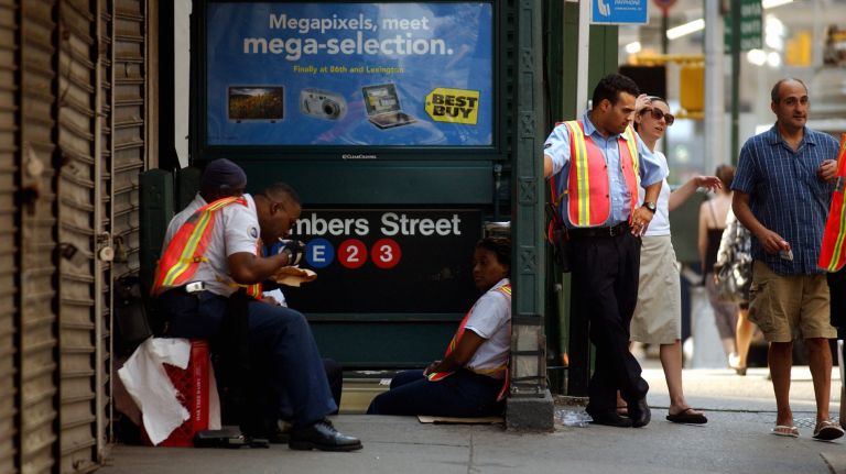 Northeast blackout 2003: Photos of NYC 11 MTA employees stand outside a subway station on Church Street in lower Manhattan waiting for service to be restored on Aug. 15, 2003, after a blackout affected much of the Northeast the day before.
