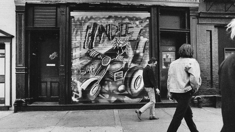 Rare images of NYC nightclubs from the 1980s and '90s, including the Limelight and Roxy 50 A street art sign for Handlebar in the East Village is seen on May 1, 1990.
