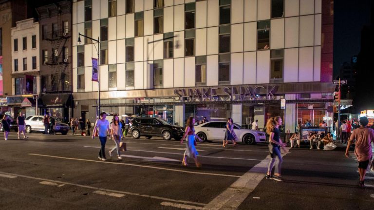 Pedestrians walk in the middle of the street while power in&nbsp;midtown was out.