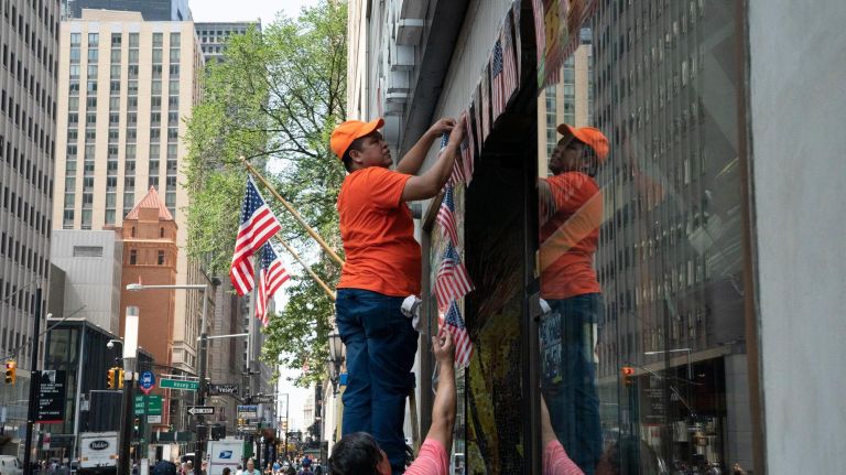 World Cup parade: Photos from the celebration for the U.S. women's soccer team 34 Workers at Gourmet Apple hang plastic American flags on the front of their store on Broadway Tuesday in preparation for the ticker-tape parade honoring the U.S. women's soccer team.