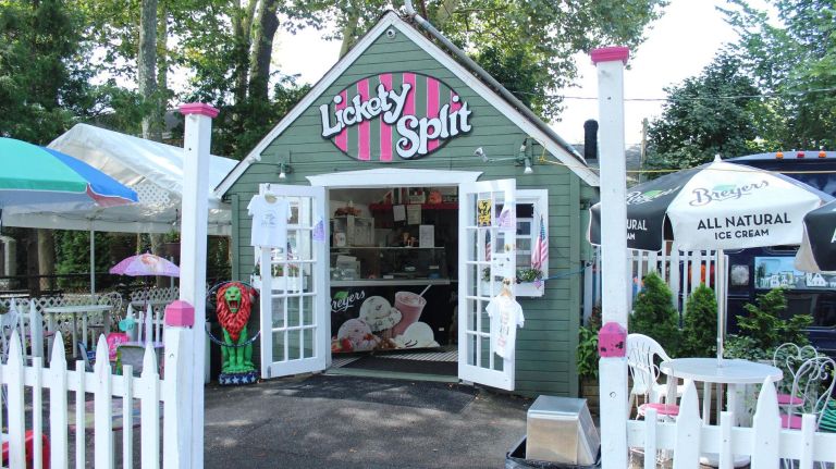 This shack-in-the-shade at 295 City Island Ave. would fit right in almost anywhere in middle America. Complete with a white picket fence and covered 