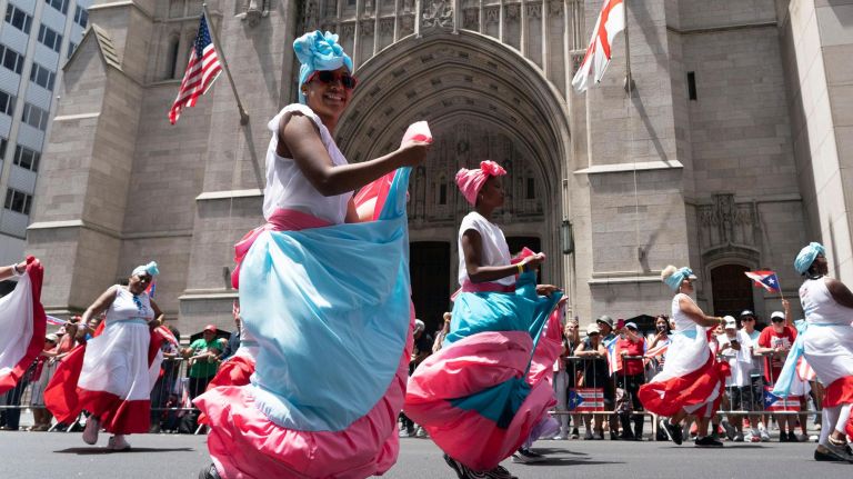 Participants dance along 5th Avenue during the 2019 Puerto Rican Day Parade, Sunday, June 9, 2019. The parade is in its 62nd year and is celebrating the creativity and diversity of thought in Puerto Rico and across the diaspora, according to the parade organizers.