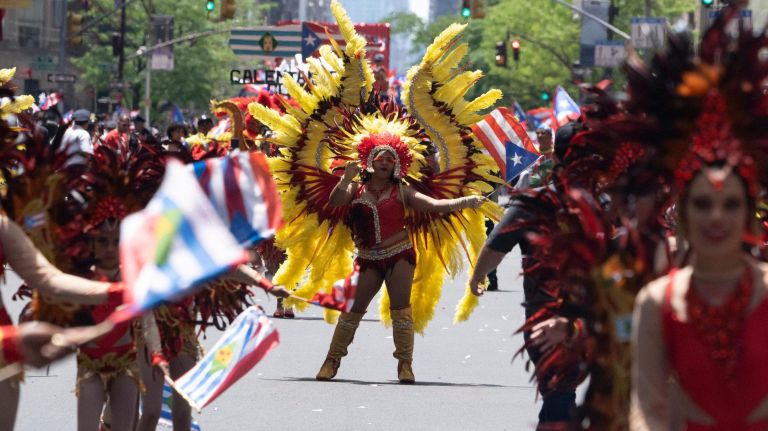 Participants dance along 5th Avenue during the 2019 Puerto Rican Day Parade, Sunday, June 9, 2019. The parade is in its 62nd year and is celebrating the creativity and diversity of thought in Puerto Rico and across the diaspora, according to the parade organizers.
