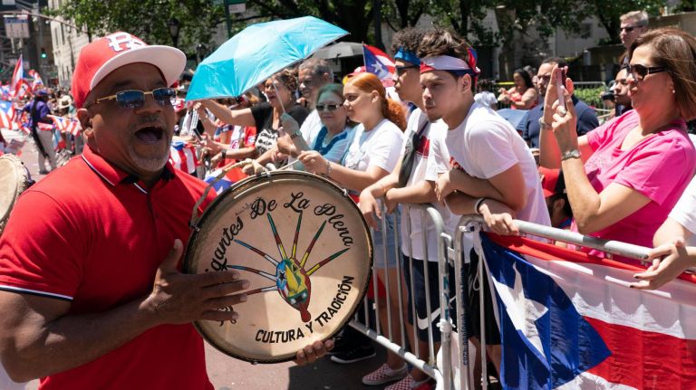 A person plays a drum on 5th Avenue in Manhattan during the 2019 Puerto Rican Day Parade, Sunday, June 9, 2019. The parade is in its 62nd year and is celebrating the creativity and diversity of thought in Puerto Rico and across the diaspora, according to the parade organizers.