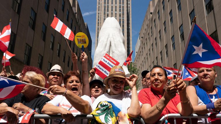 Crowds line 5th Avenue in Manhattan waving flags and cheering during the 2019 Puerto Rican Day Parade, Sunday, June 9, 2019. The parade is in its 62nd year and is celebrating the creativity and diversity of thought in Puerto Rico and across the diaspora, according to the parade organizers.