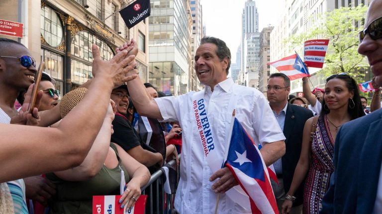 New York State Gov.&nbsp;Andrew M. Cuomo reaches out to spectators lining 5th Avenue during the 2019 Puerto Rican Day Parade, Sunday, June 9, 2019. The parade is in its 62nd year and is celebrating the creativity and diversity of thought in Puerto Rico and across the diaspora, according to the parade organizers.