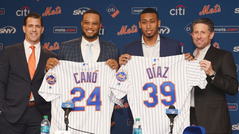 Mets general manager Brodie Van Wagenen, left, and COO Jeff Wilpon, right, welcome Robinson Cano and Edwin Diaz to the Mets in a movie that revamped the team's lineup and bullpen.