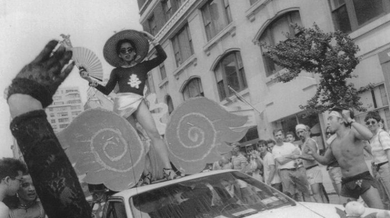Members of the Gay Asians Group perform for spectators at the NYC Pride March on June 30, 1991. 