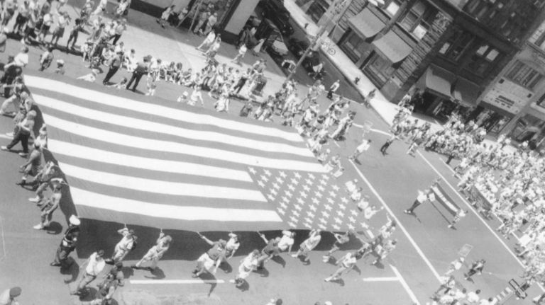 Members of the Gay Veterans Association carry a large American flag down Fifth Avenue during the NYC Pride March on June 27, 1993. 