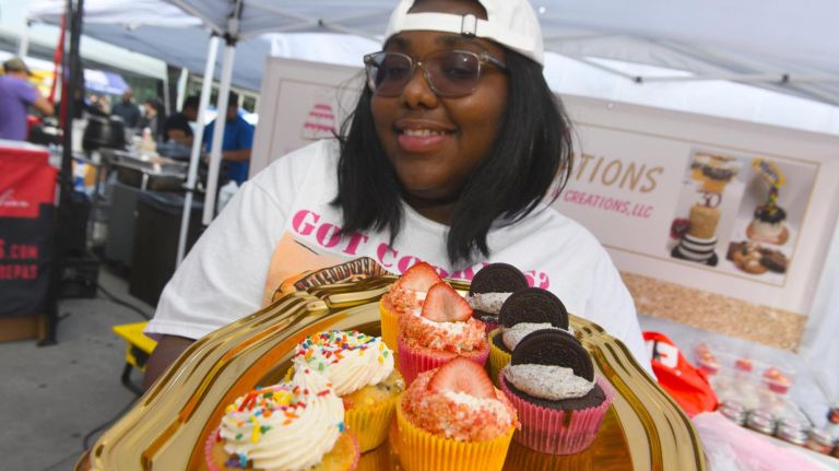 Christine Alexander bakes cupcakes specially for The Bronx Night Market. The market began its second season with a bang as thousands flocked to try the variety of food and drink at the Fordham Plaza site in the Bronx.