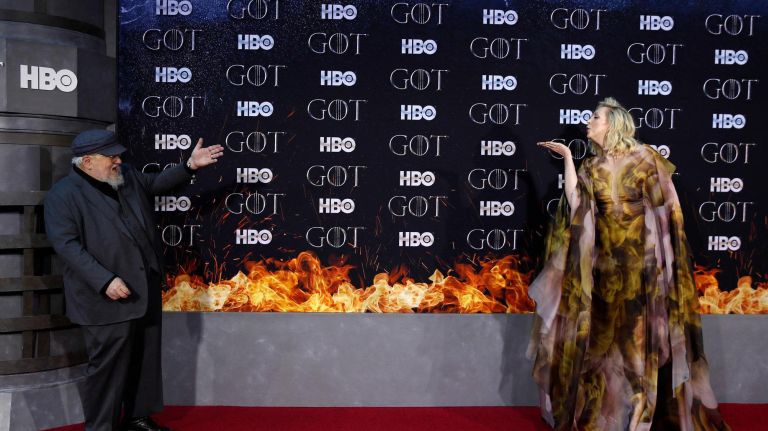 Mandatory Credit: Photo by JASON SZENES/EPA-EFE/REX/Shutterstock (10186128d) Gwendoline Christie (R) blows a kiss to US novelist George R.R. Martin (L) as they arrive for the New York red carpet premiere for the eighth and final season of Game of Thrones at Radio City Music Hall in New York, New York, USA, 03 April 2019. New York red carpet premiere of Game of Thrones, USA - 03 Apr 1919