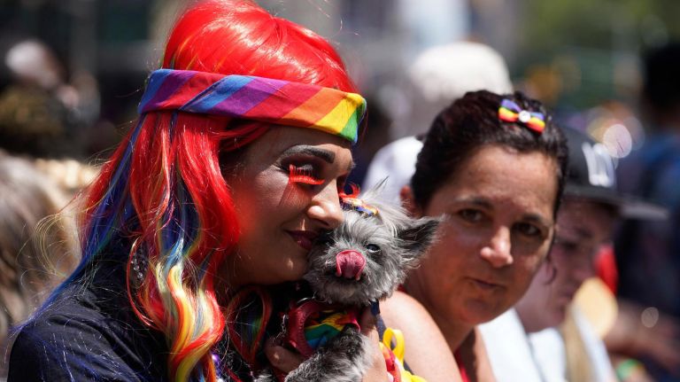 Photos from NYC Pride March, marking 50 years since Stonewall 20 Ally Smith from Maspeth holds Lilly, a 13-year-old rescue Chorkie.