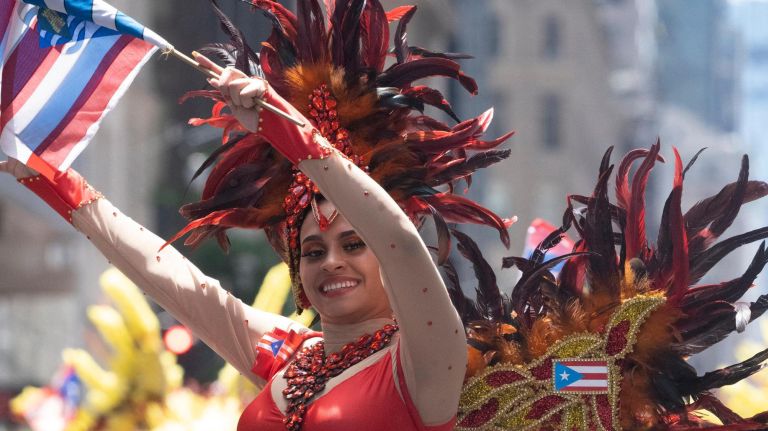 Participants dance along 5th Avenue during the 2019 Puerto Rican Day Parade, Sunday, June 9, 2019. The parade is in its 62nd year and is celebrating the creativity and diversity of thought in Puerto Rico and across the diaspora, according to the parade organizers.