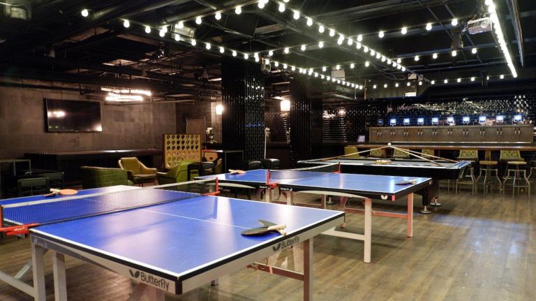 This 16,000-square-foot bar is essentially an adult playground, complete with three bowling lanes, karaoke room, ping-pong, pool tables, Skeeball, pinball, foosball, and even a 20-foot slide. They also have a 