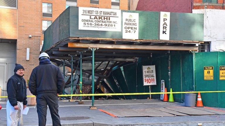 The building was in the process of being demolished when the rear portion collapsed unexpectedly, officials said.