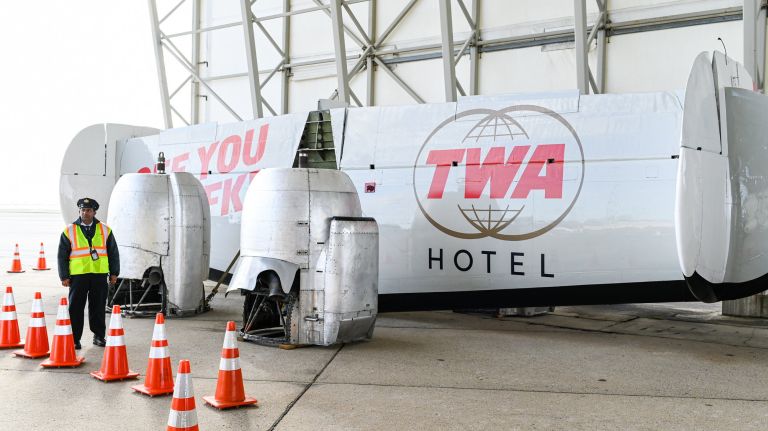 The tail piece and engine parts for the TWA L-1649A Starliner airpline arrive at JFK, where they will be&nbsp;turned into a cocktail lounge and restaurant outside the future TWA Hotel.