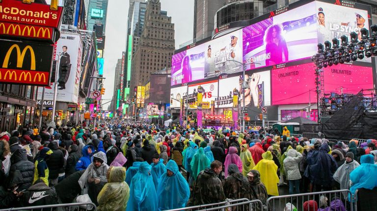 Poncho-wearing revelers (umbrellas are not allowed, per the NYPD) await the New Year's Eve celebrations in the holding pens in Manhattan's Times Square amid the rain on Dec. 31, 2018. Are you glad you stayed in to welcome 2019?