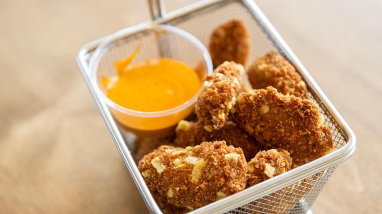 The burger joint's Impossible Burger comes to the stadium this season so vegans and vegetarians alike can bite into a 