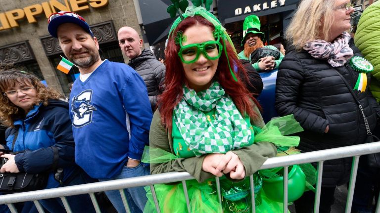 Thousands took part in this year's St. Patrick's Day Parade in Manhattan. Celebrants watch the parade.