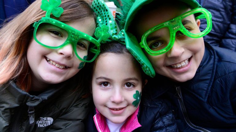 Lisa, left, Lauren, center, and Brendan McKenzie enjoy the 2019 annual St. Patrick's Day parade on March 16, 2019 in New York City. The New York City St. Patrick's Day parade, dating back to 1762, is the world's largest St. Patrick's Day celebration.