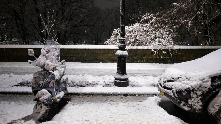 Vehicles are caked with wet snow on Central Park West on March 4, 2019.