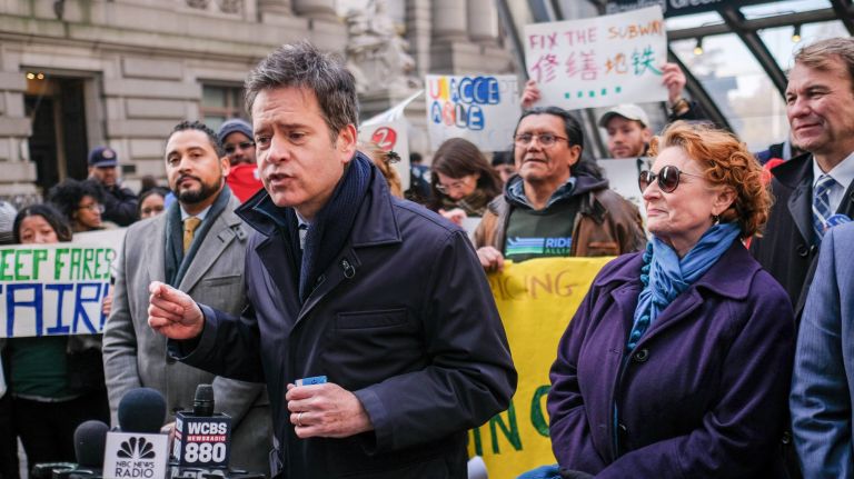 Staten Sen. Brad Hoylman rallies with other elected officials and organizations outside of MTA headquarters on Wednesday to protest the next round of fare and toll hikes planned for early next year.&nbsp;