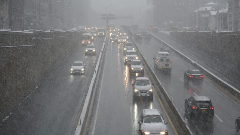 Cars in the snow on the Jackie Robinson Parkway in Kew Gardens, Queens, on Nov. 15, 2018.