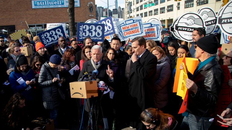 City Councilman Jimmy Van Bramer, center, along with State Sen. Michael Gianaris and other local representatives and community members protested&nbsp;Amazon's planned headquarters in Long Island City on Wednesday.