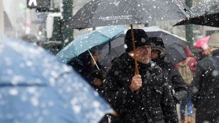 People cross West 34th Street in Manhattan on March 21, 2018.