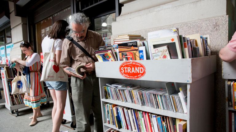 People browse books outside Strand Book Store in lower Manhattan.