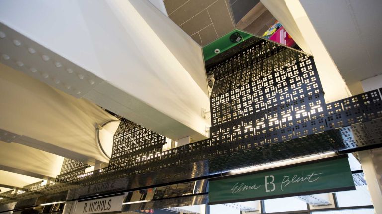 TurnStyle Columbus Circle: Food hall and retail shops open in subway station 20 Stephen Nielson of Architecture Outfit hired Kammetal of Red Hook, Brooklyn to create the dark metal stencil designs and mirrors that line the ceiling of TurnStyle.