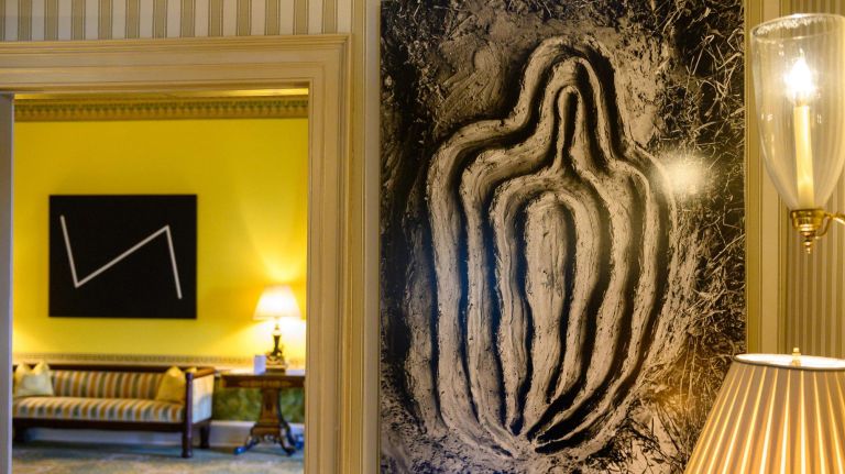 "Yesterday" by Carmen Herrera, left, and "La Vivacacion de la Carne (Vivafication of the Flesh)" by Ana Mendieta are displayed at Gracie Mansion.