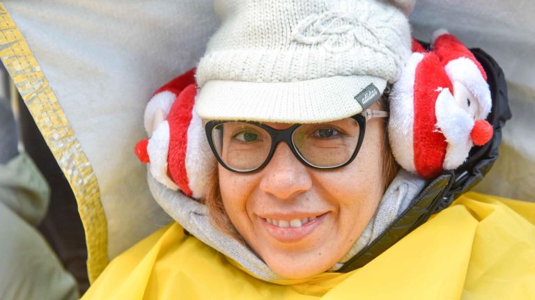 People are bundled up in many different ways before the Macy's Thanksgiving Parade on Thursday.