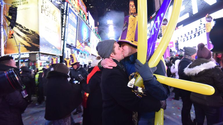 Confetti rains down on New Year's Eve revelers as they celebrate in a frigid Times Square in Manhattan on Sunday, Dec, 31, 2017.