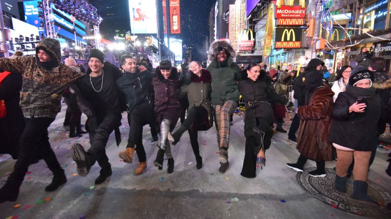 Confetti rains down on New Year's Eve revelers as they celebrate in a frigid Times Square in Manhattan on Sunday, Dec. 31, 2017.