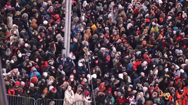 New Year's Eve revelers get ready to celebrate in a frigid Times Square on Sunday, Dec. 31, 2017.