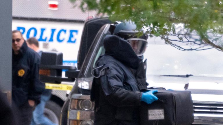 Best of 2018: Top New York City photos of the year 45 BETTER QUALITY An NYPD bomb unit member appears to be removing a suspicious package discovered Friday, Oct. 26, 2018, at a US Post Office on W 52 st in Manhattan.