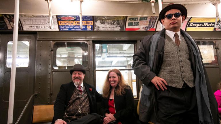 Inside the MTA nostalgia train 14 Stewart Svendsen of Brooklyn, in 1918-1920s attire, sits with Mary Dove dressed in 1940s clothing and Eddie Abreu of Queens. Svendsen has been doing this for about seven years but for Dove, it's her first time. "As a vintage fan that wants to experience the old school ... for me is a very exhilarating experience," Abreu said. "The nostalgia trains are the best in the world."