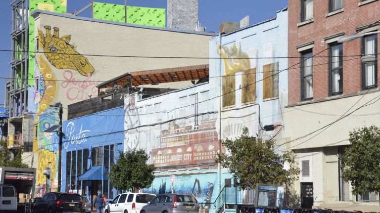 Jersey City: What to do in the neighboring big town 23 Jersey City is a colorful place with tons of street art to admire as you shop. Head toward Grove Street and Newark Avenue to start your retail journey.