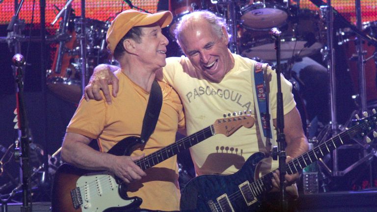 Paul Simon and Jimmy Buffett play the Big Easy concert at Madison Square Garden to benefit Hurricane Katrina recovery efforts on Sept. 20, 2005. 