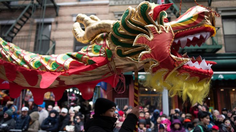 A dragon dances over the parade route.