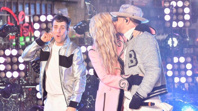 NEW YORK, NY - DECEMBER 31: Joey McIntyre, Jenny McCarthy and Donnie Wahlberg on stage during Dick Clark's New Year's Rockin' Eve With Ryan Seacrest 2019 on December 31, 2018 in New York City. (Photo by Eugene Gologursky/Getty Images for Dick Clark's New Year's Rockin' Eve)