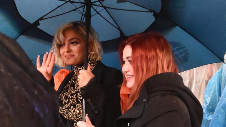 Many people attended the Times Square New Year's Eve ball drop in Times Square, many getting there early in the morning. Singer Bebe Rexha gets ready for her performance in the rain.