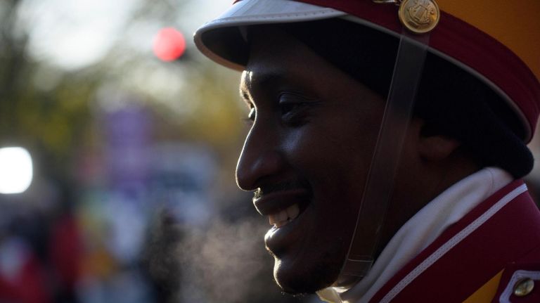 Participants get ready for the start of the 92nd Macy's Thanksgiving Day Parade in Manhattan on Thursday. The iconic parade debuted in 1924 and featured live animals like monkeys, bears, camels and elephants borrowed from nearby Central Park. The show took a break in 1942, 1943 and 1944, when the balloons were donated to the U.S. government during World War II, providing 650 pounds of scrap rubber for the war effort.